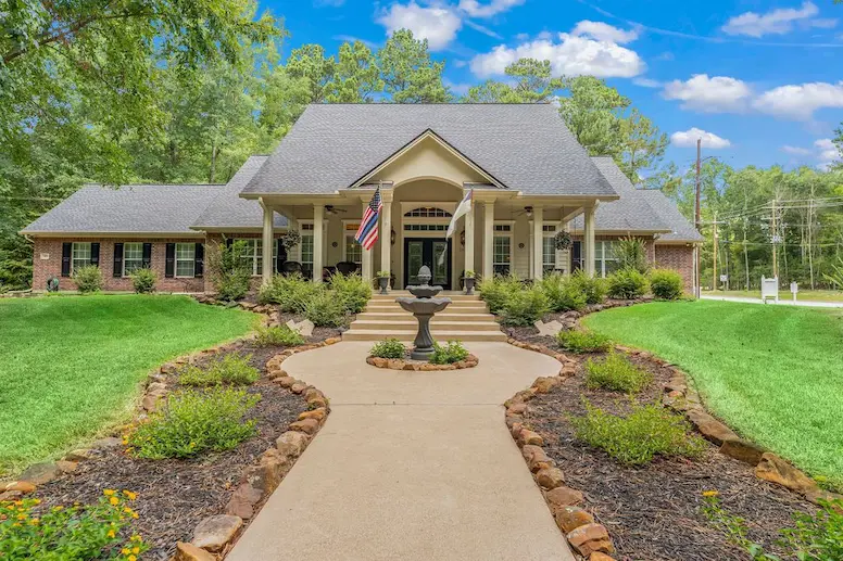 Charming home with a welcoming walkway leading to the front door