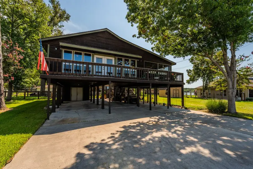 Spacious home featuring a large deck and expansive yard