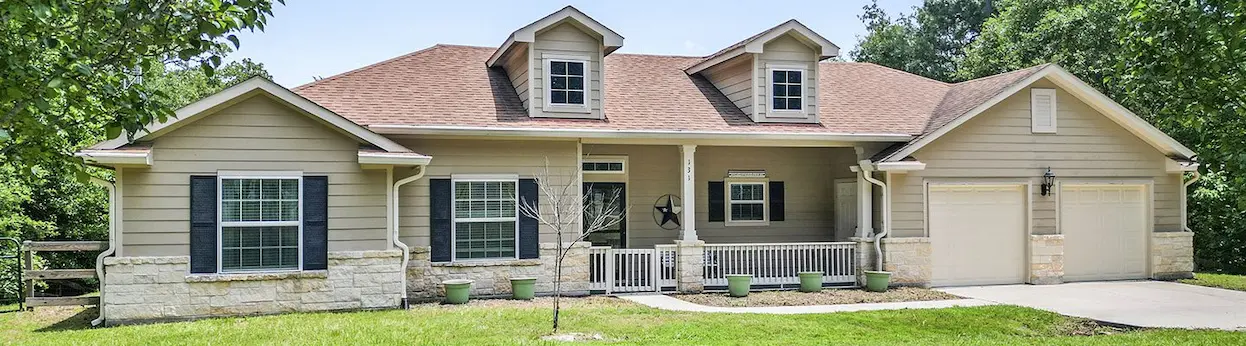 Spacious home featuring two garages, perfect for car enthusiasts or extra storage needs.