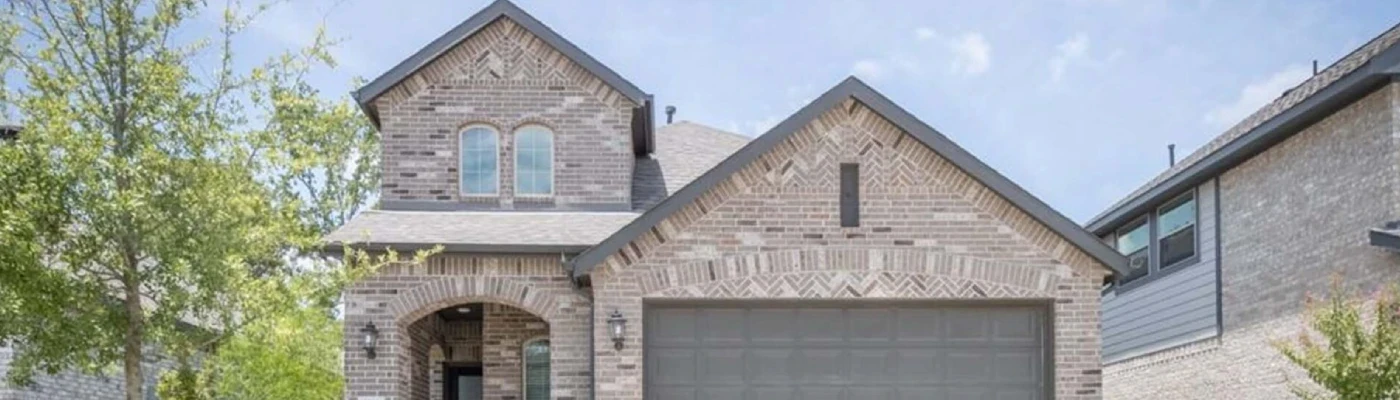 Inviting suburban residence with a well-maintained driveway and garage