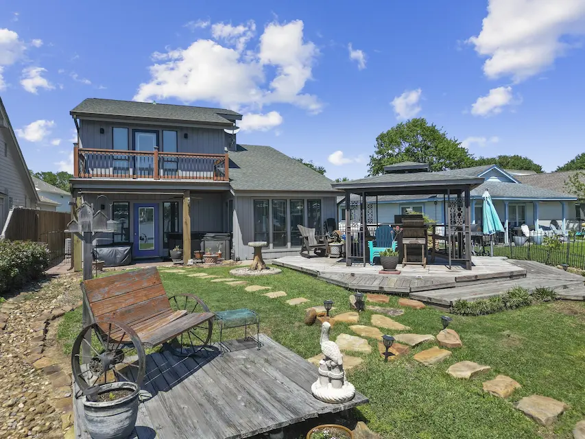 A charming home featuring a gazebo and a spacious patio