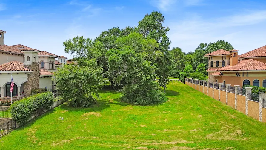 A lot, surrounded by neighboring homes, ideal for family living.