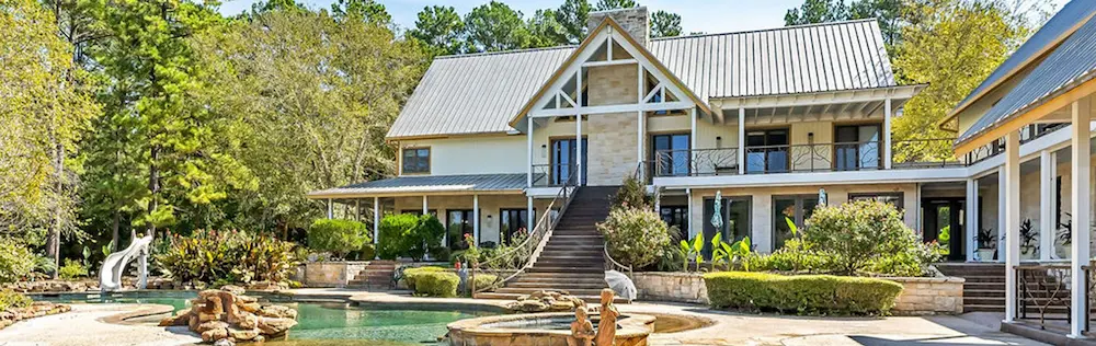 A spacious house featuring a large pool and an inviting patio