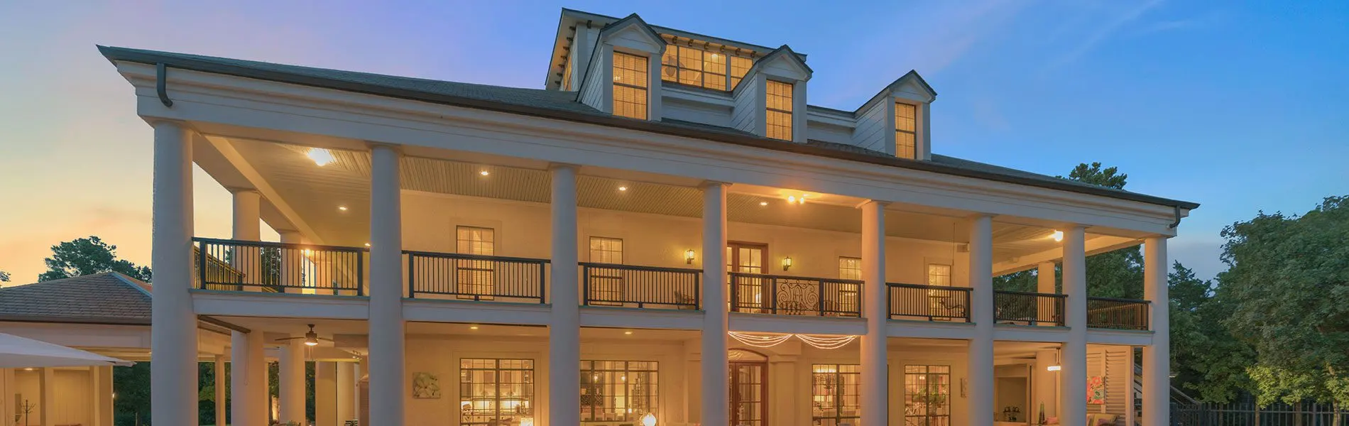 A large modern home with a spacious patio