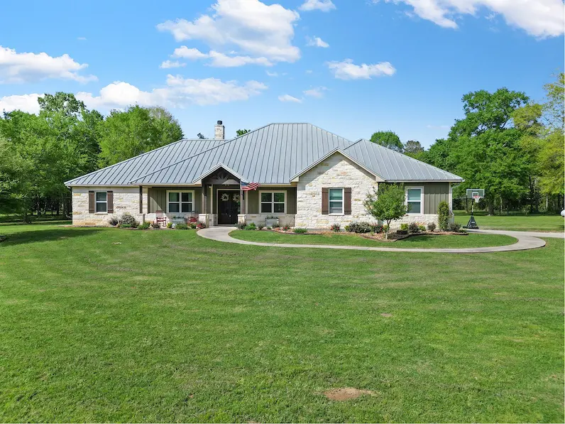 A spacious ranch home with a large yard